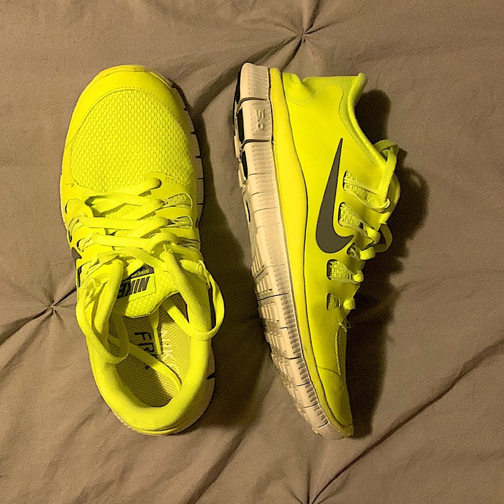 Neon yellow Nike running shoes